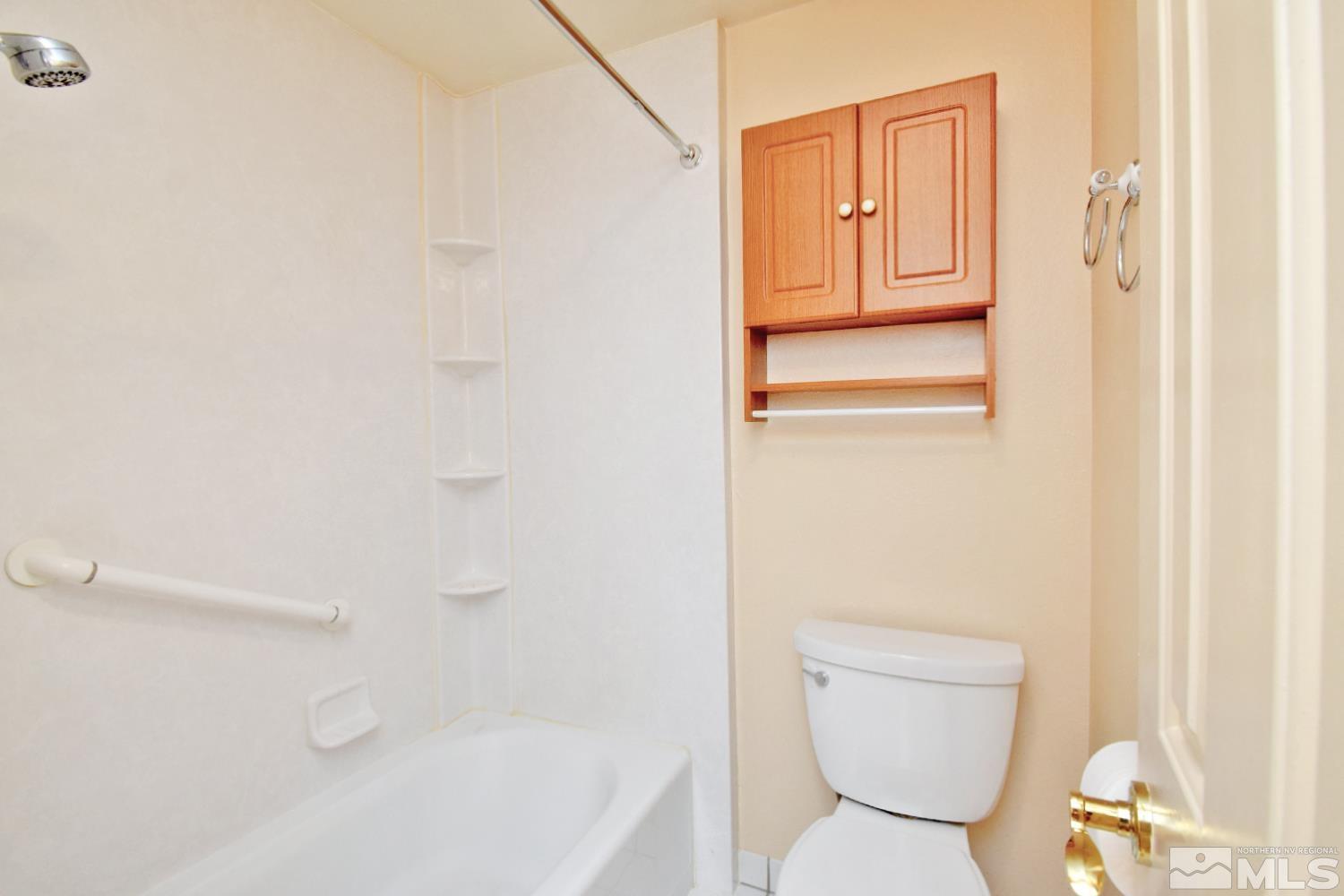 1113 Frontier Court Reno, NV 89503 - Photo 31 of 40 a bathroom with a toilet and a shower