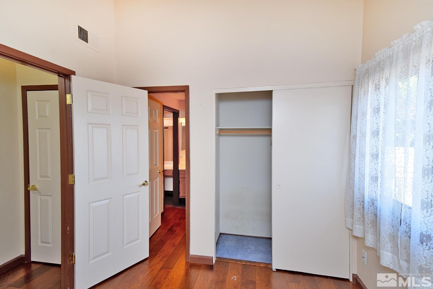 1113 Frontier Court Reno, NV 89503 - Photo 33 of 40 an empty room with wooden floor & a window