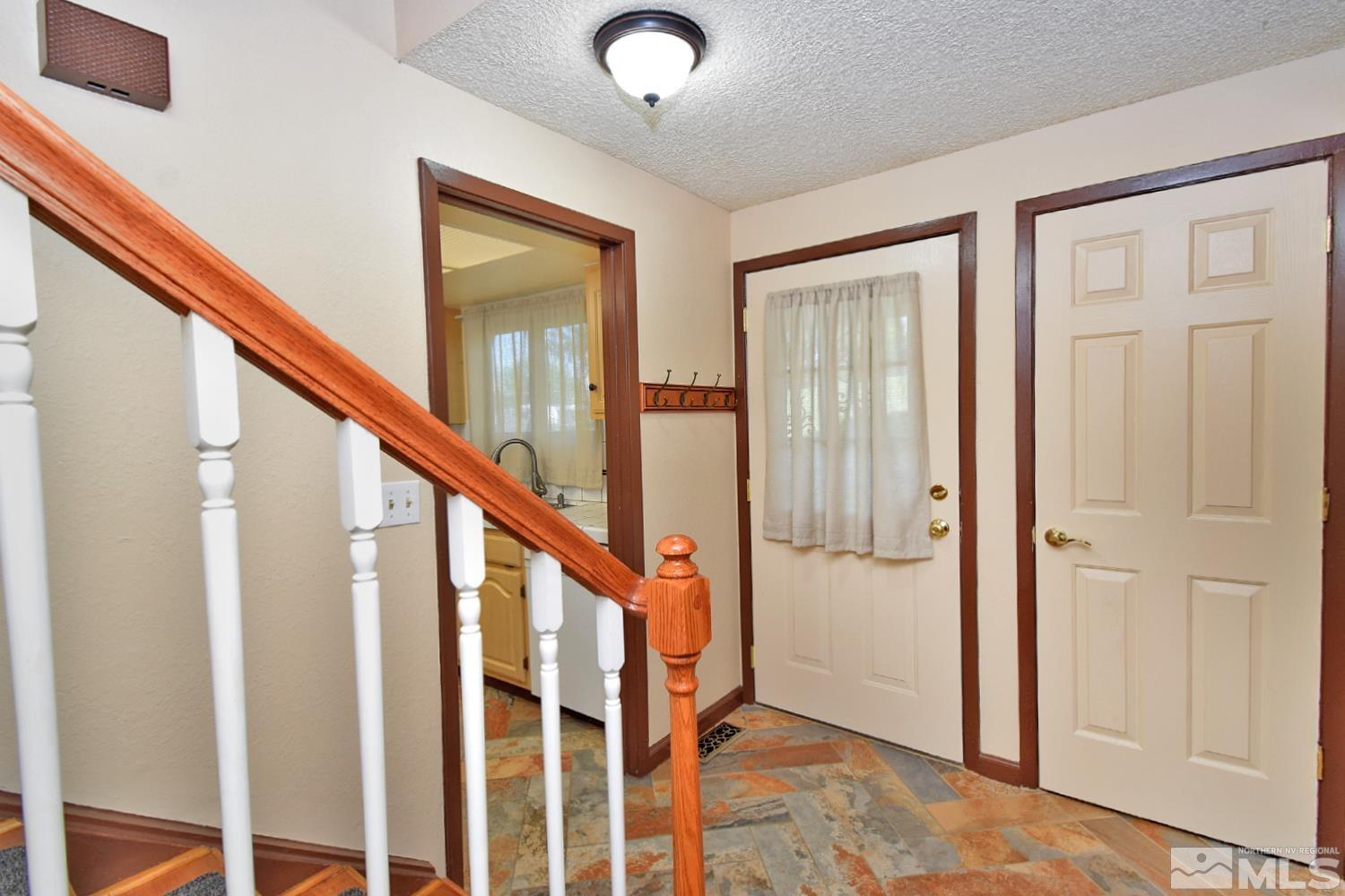1113 Frontier Court Reno, NV 89503 - Photo 5 of 40 a view of an entryway with staircase