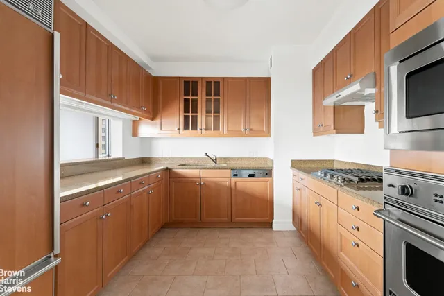 a bedroom with furniture and a potted plant