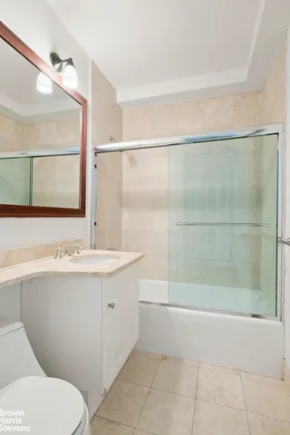 a large kitchen with stainless steel appliances a large counter top