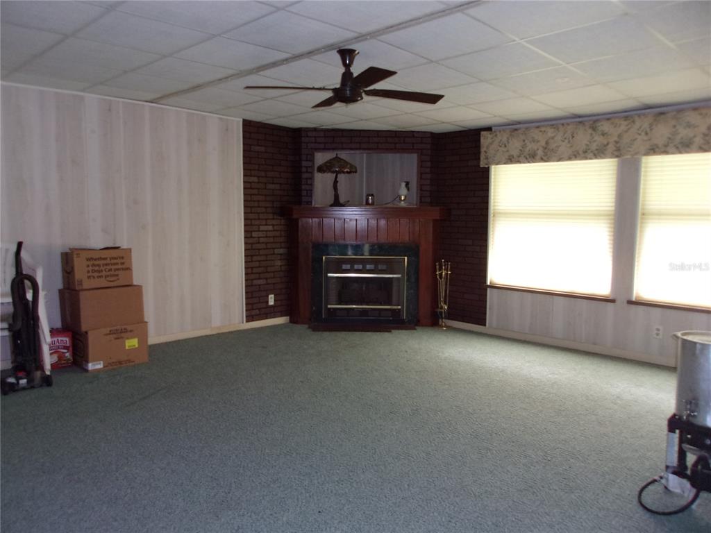 6485 Northeast 2nd Street Ocala, FL 34470 - Photo 11 of 55 a view of a livingroom with furniture and a window