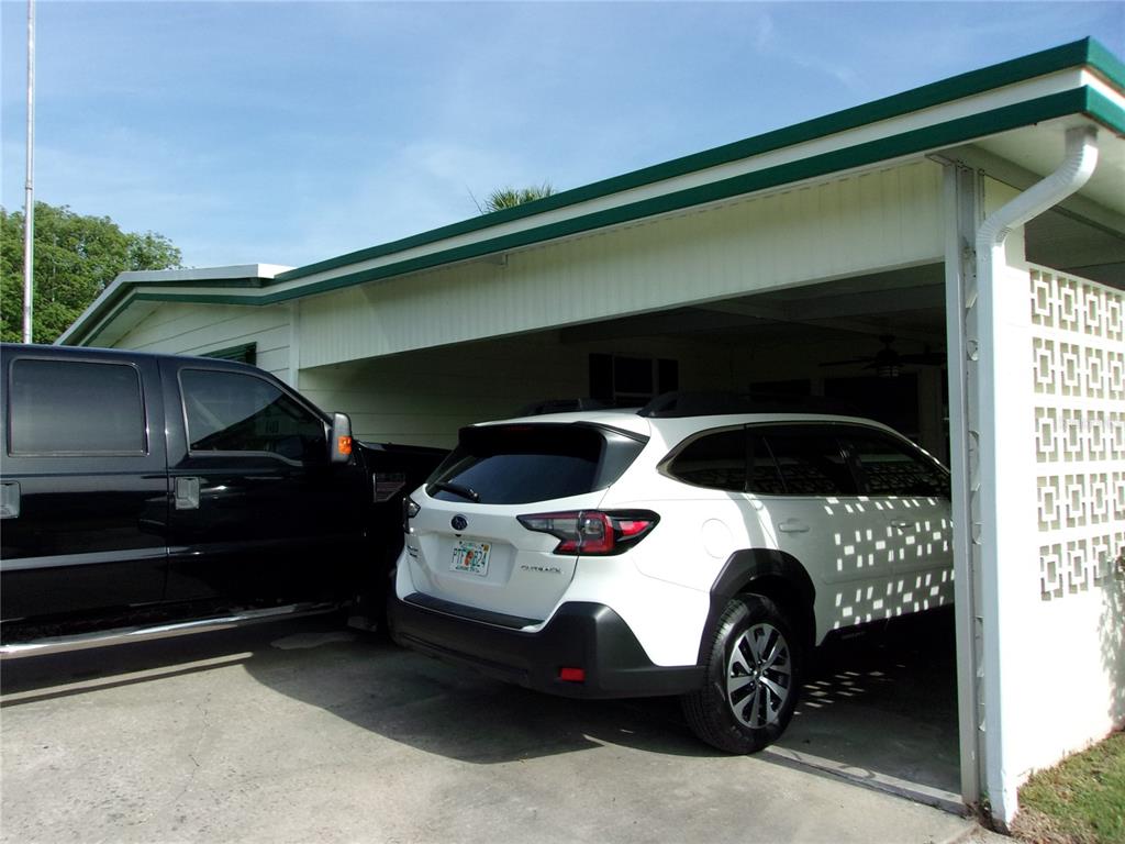 6485 Northeast 2nd Street Ocala, FL 34470 - Photo 2 of 55 a car parked in front of a house