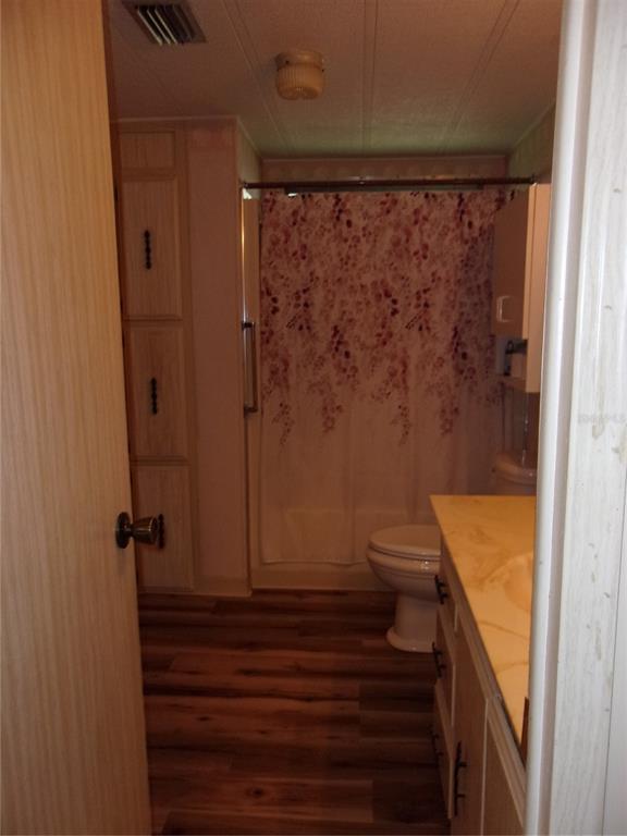6485 Northeast 2nd Street Ocala, FL 34470 - Photo 29 of 55 a bathroom with a shower and a toilet