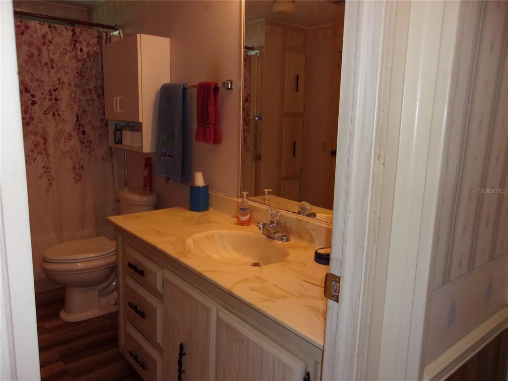 6485 Northeast 2nd Street Ocala, FL 34470 - Photo 30 of 55 a bathroom with a sink and a toilet