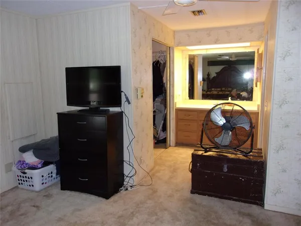 a kitchen with a sink cabinets and appliances