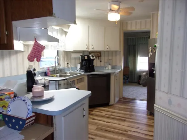 a room with fridge and rack