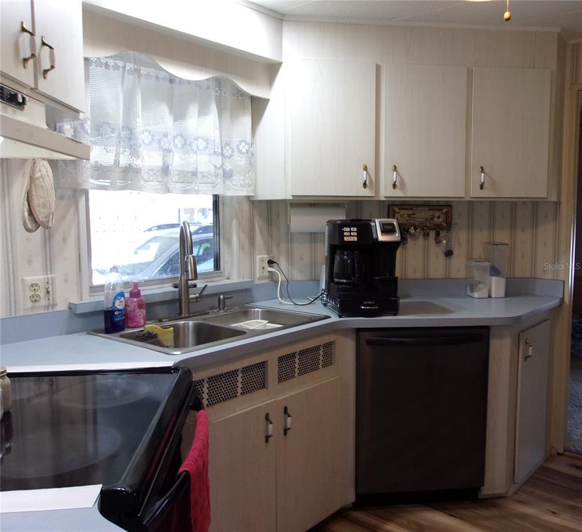 6485 Northeast 2nd Street Ocala, FL 34470 - Photo 39 of 55 a kitchen with a sink and cabinets