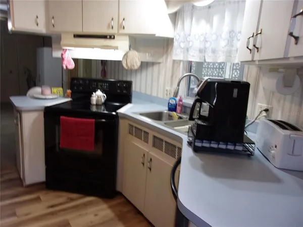 a room with furniture and book shelf