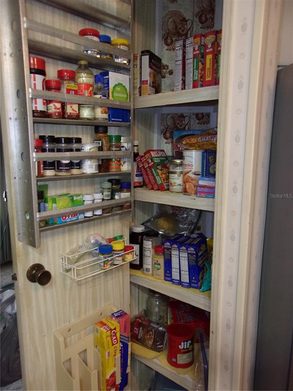 6485 Northeast 2nd Street Ocala, FL 34470 - Photo 41 of 55 a room with fridge and rack