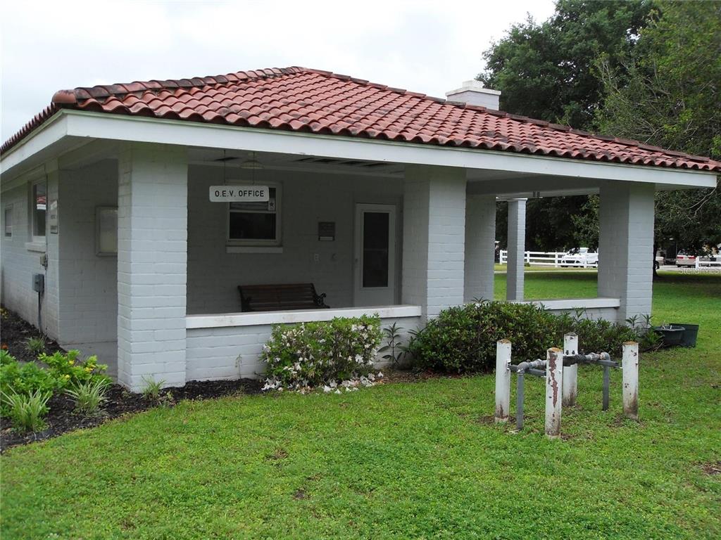 6485 Northeast 2nd Street Ocala, FL 34470 - Photo 45 of 55 a front view of a house with a yard