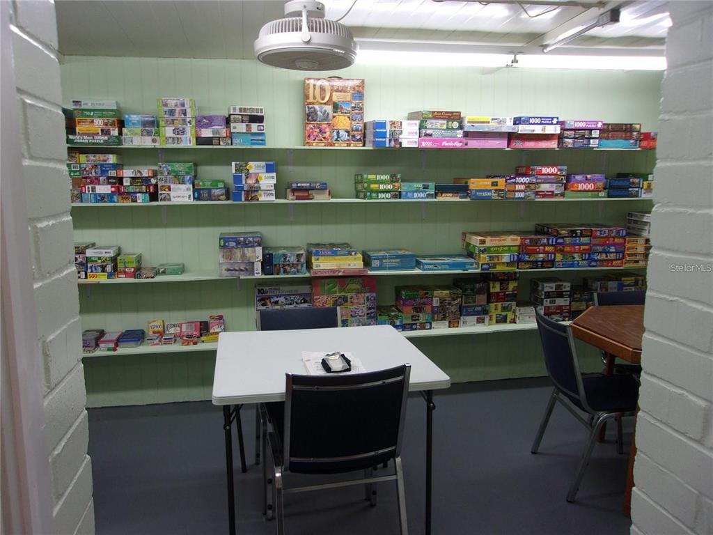 6485 Northeast 2nd Street Ocala, FL 34470 - Photo 53 of 55 a room with stainless steel appliances kitchen island dining table and chairs