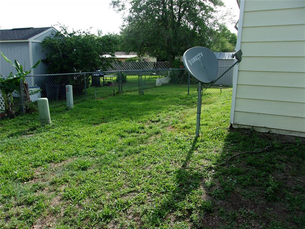 6485 Northeast 2nd Street Ocala, FL 34470 - Photo 7 of 55 a garden with plants and garden