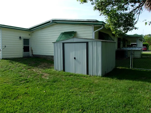 a living room with furniture a fireplace and a window