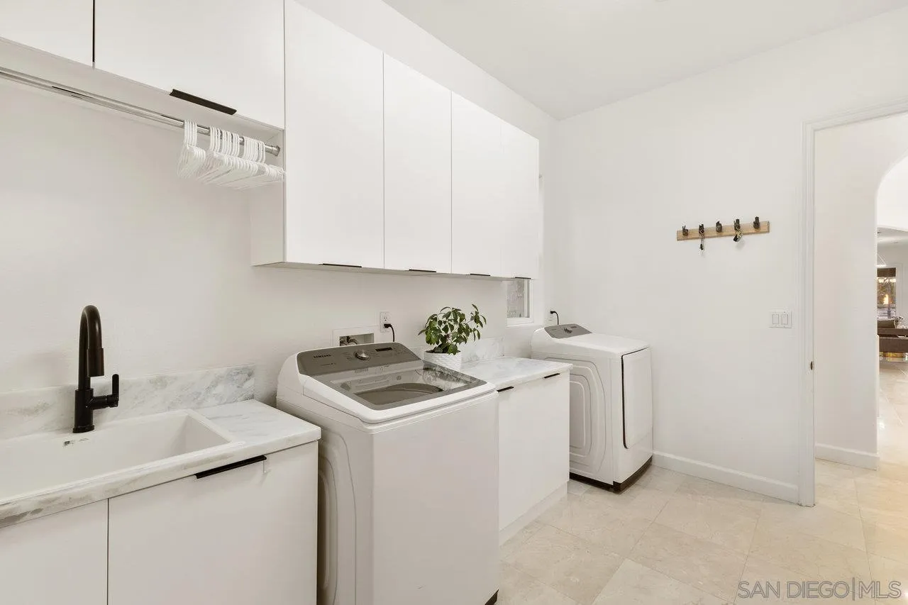 17133 Castello Circle San Diego, CA 92127 - Photo 28 of 48 a view of a kitchen with sink and washing machine