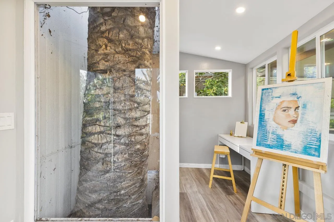 17133 Castello Circle San Diego, CA 92127 - Photo 35 of 48 a view of a hallway with wooden floor and dining room view
