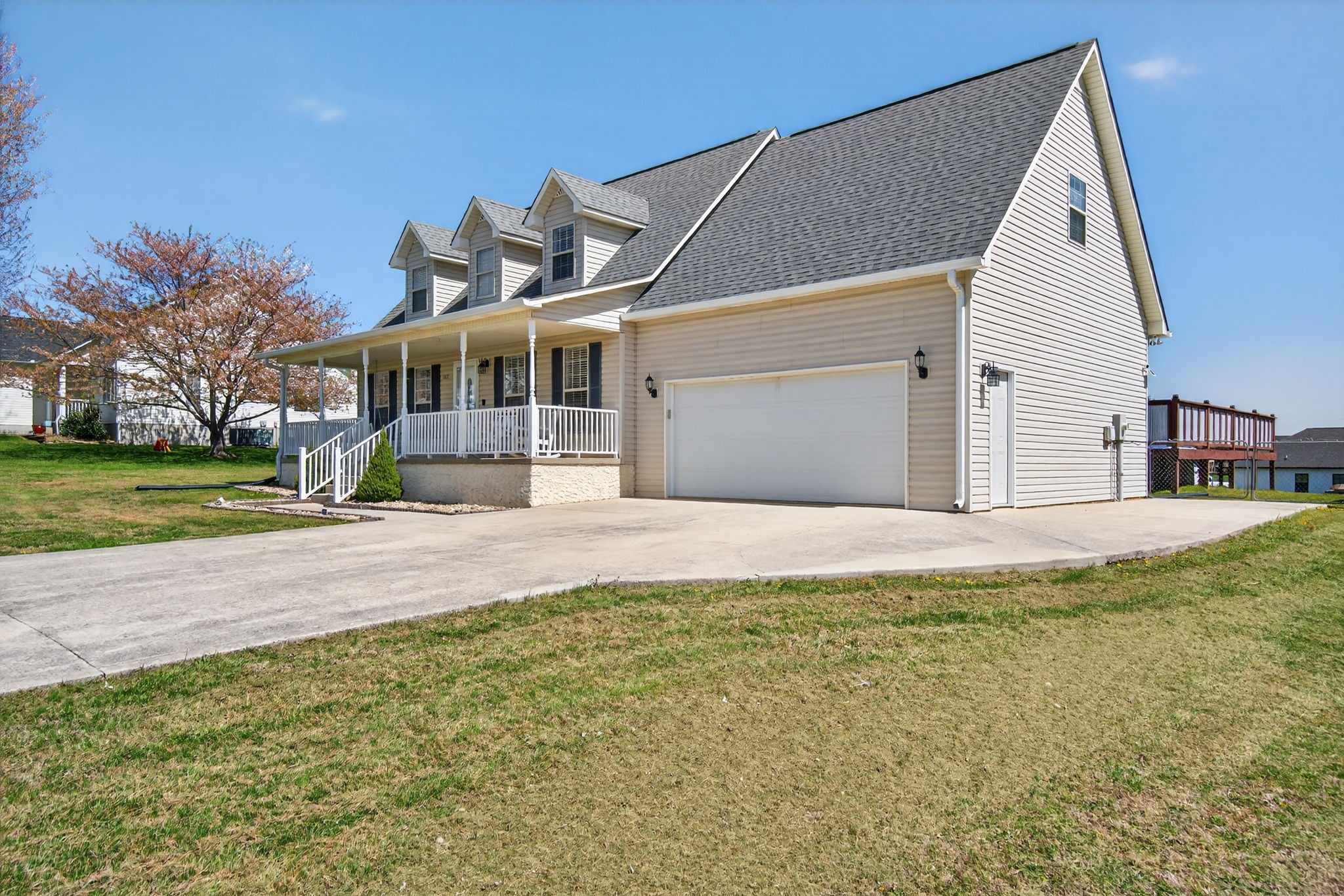3432 WJ Robinson Road Cookeville, TN 38506 - Photo 26 of 32 a view of a white house with a big yard and large trees