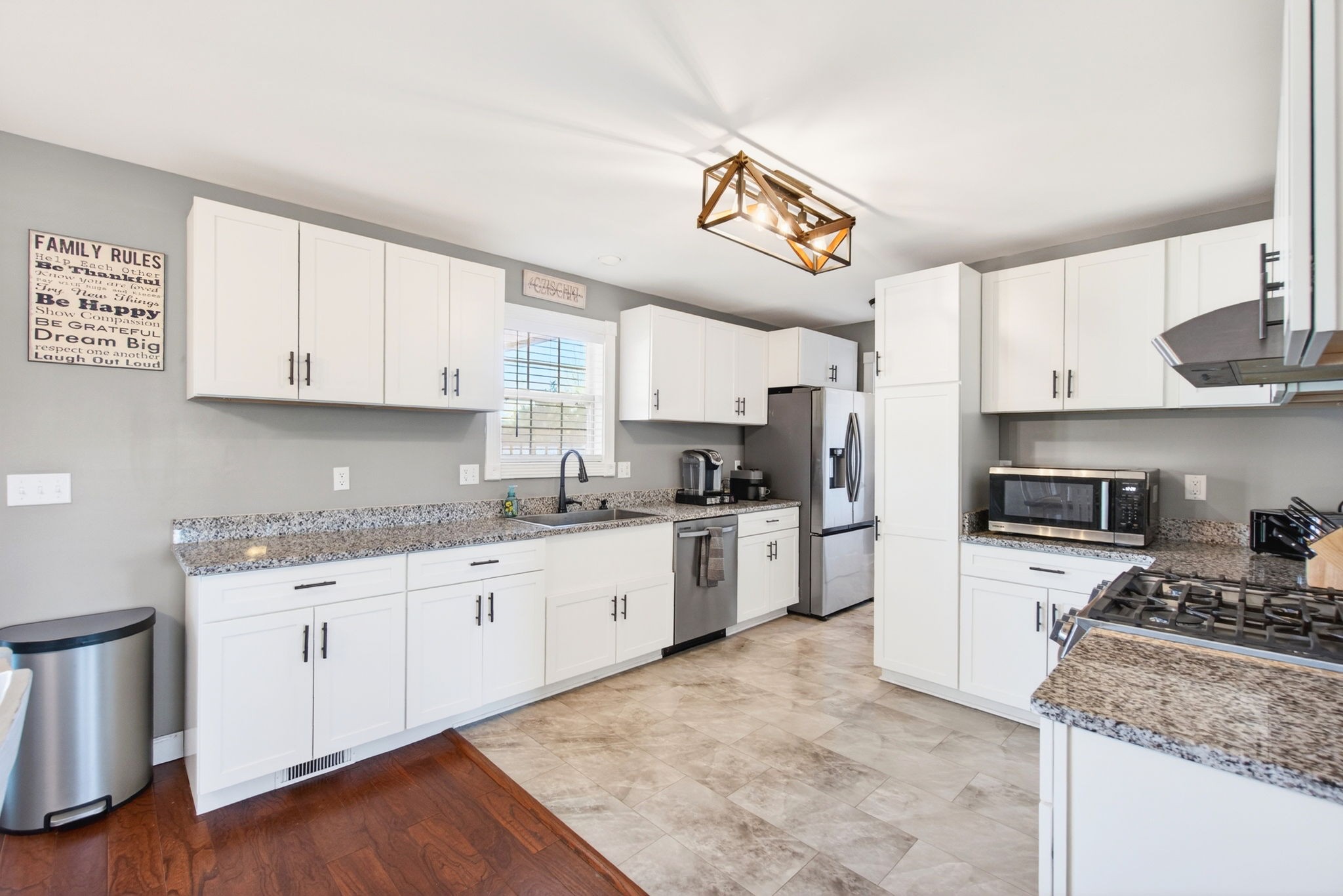 3432 WJ Robinson Road Cookeville, TN 38506 - Photo 4 of 32 a kitchen with kitchen island granite countertop a sink cabinets stainless steel appliances and a counter space