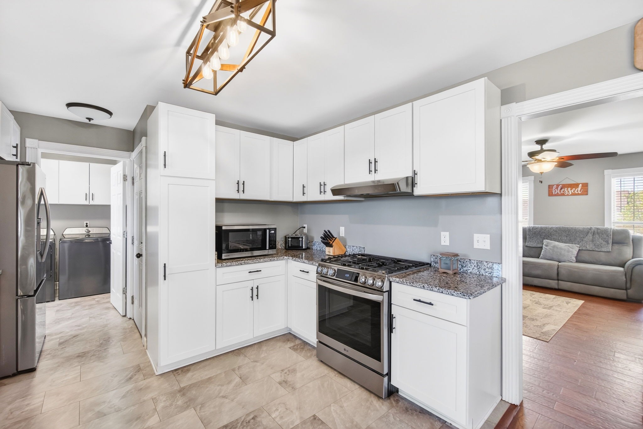 3432 WJ Robinson Road Cookeville, TN 38506 - Photo 5 of 32 a kitchen with stainless steel appliances granite countertop a stove a sink and a refrigerator