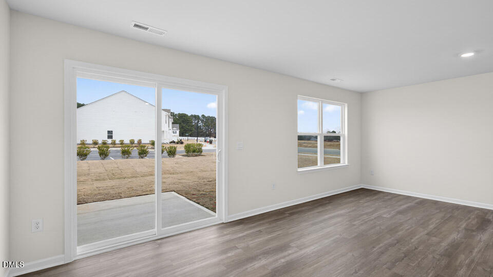 16 Red Clover Drive Angier, NC 27501 - Photo 12 of 36 a view of a room with window and wooden floor