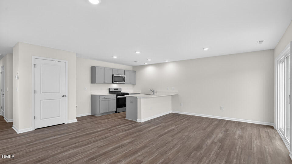 16 Red Clover Drive Angier, NC 27501 - Photo 15 of 36 a view of kitchen with wooden floor and electronic appliances