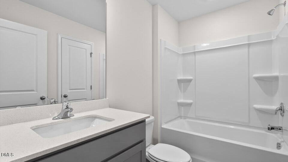 16 Red Clover Drive Angier, NC 27501 - Photo 21 of 36 a bathroom with a sink toilet and bathtub