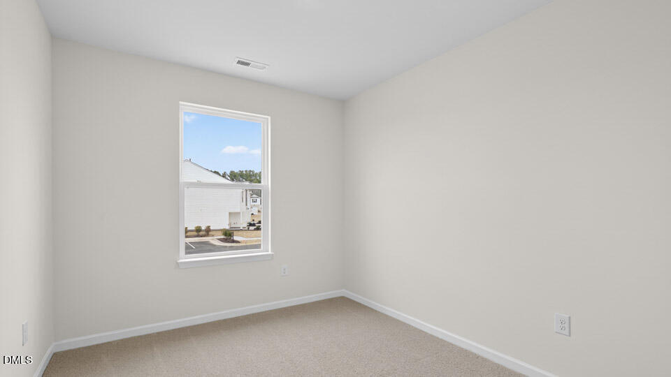 16 Red Clover Drive Angier, NC 27501 - Photo 22 of 36 a view of room with window and ceiling fan