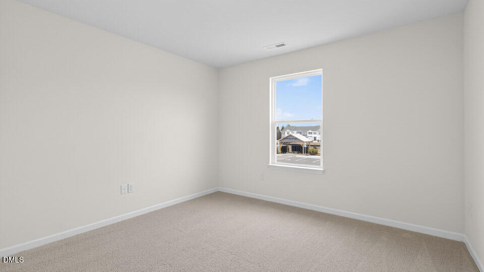 16 Red Clover Drive Angier, NC 27501 - Photo 25 of 36 an empty room with a window