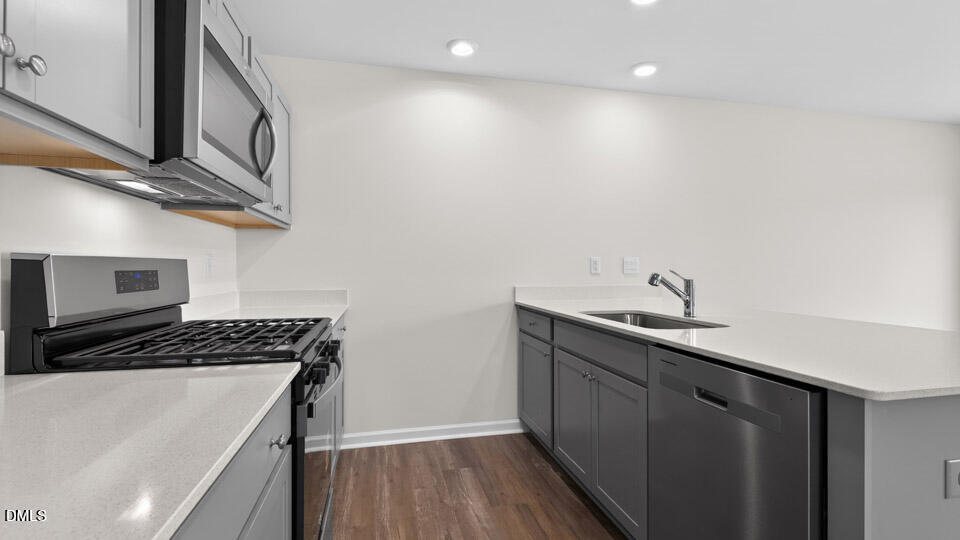 16 Red Clover Drive Angier, NC 27501 - Photo 7 of 36 a kitchen that has a sink and a stove