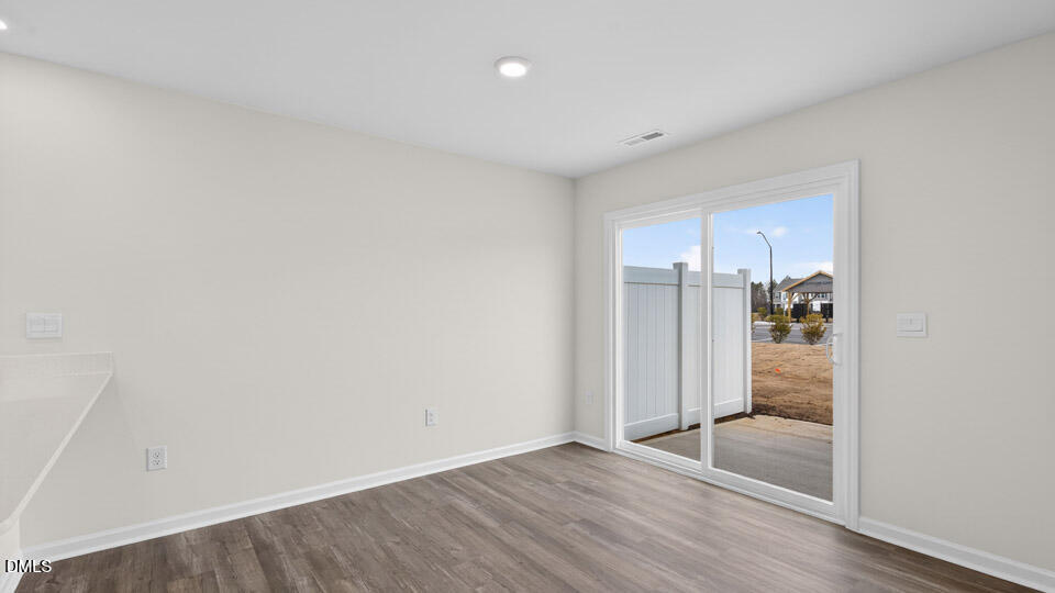 16 Red Clover Drive Angier, NC 27501 - Photo 10 of 36 a view of a hallway with wooden floor