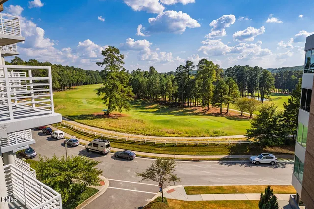 a view of a swimming pool with a yard
