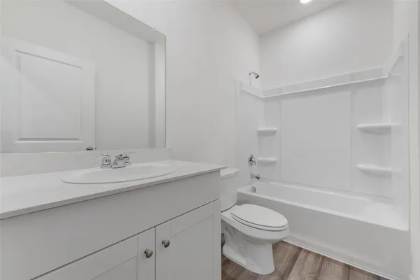 a bathroom with a sink a toilet and a bathtub