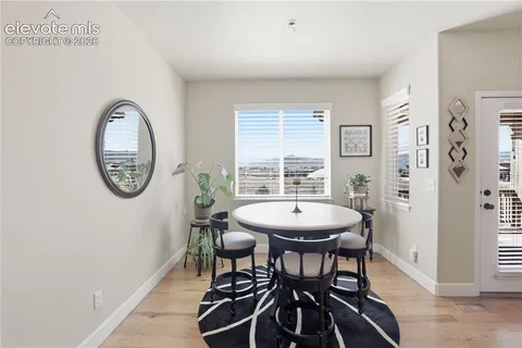 a view of a dining room with furniture and window
