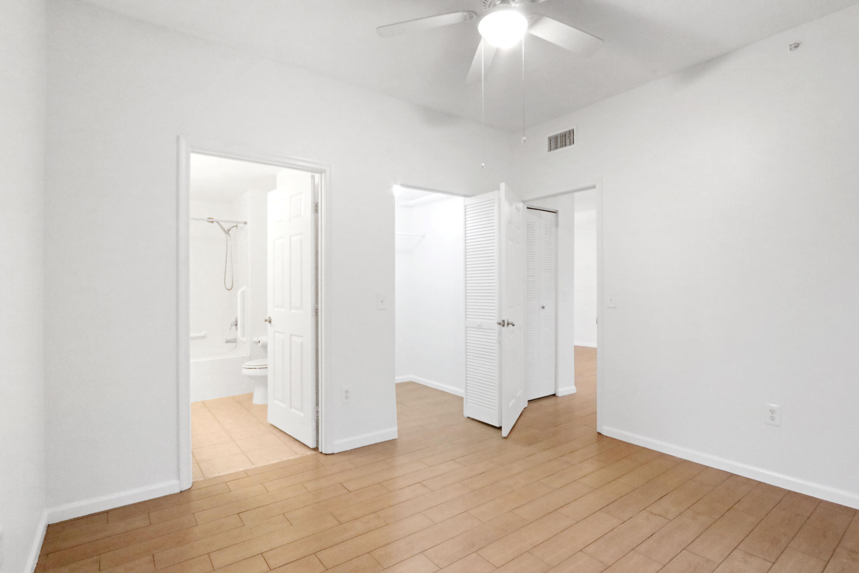 4784 Central Boulevard, Unit 10 Jupiter, FL 33458 - Photo 19 of 29 wooden floor in an empty room