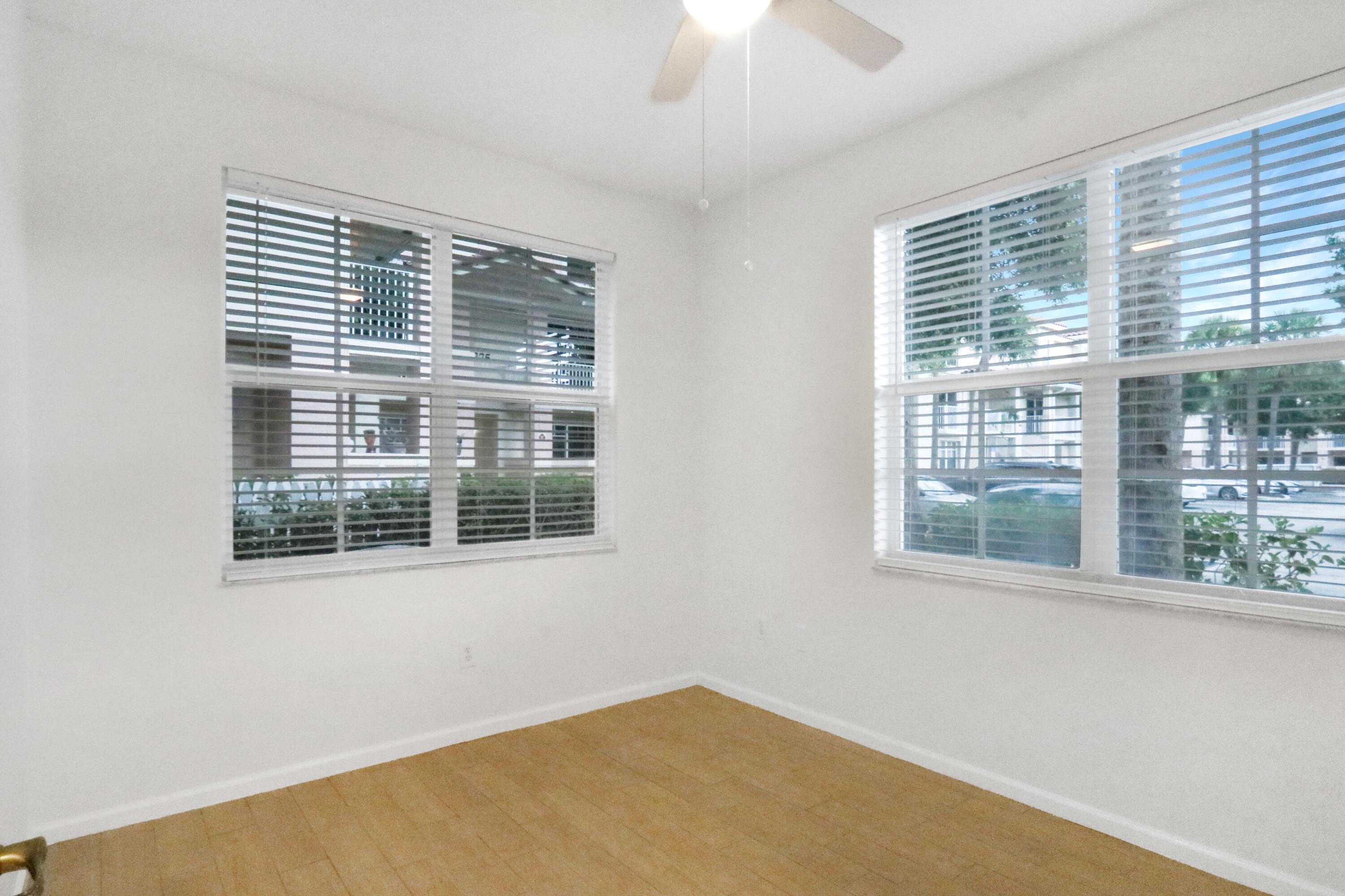 4784 Central Boulevard, Unit 10 Jupiter, FL 33458 - Photo 22 of 29 a view of an empty room with a window