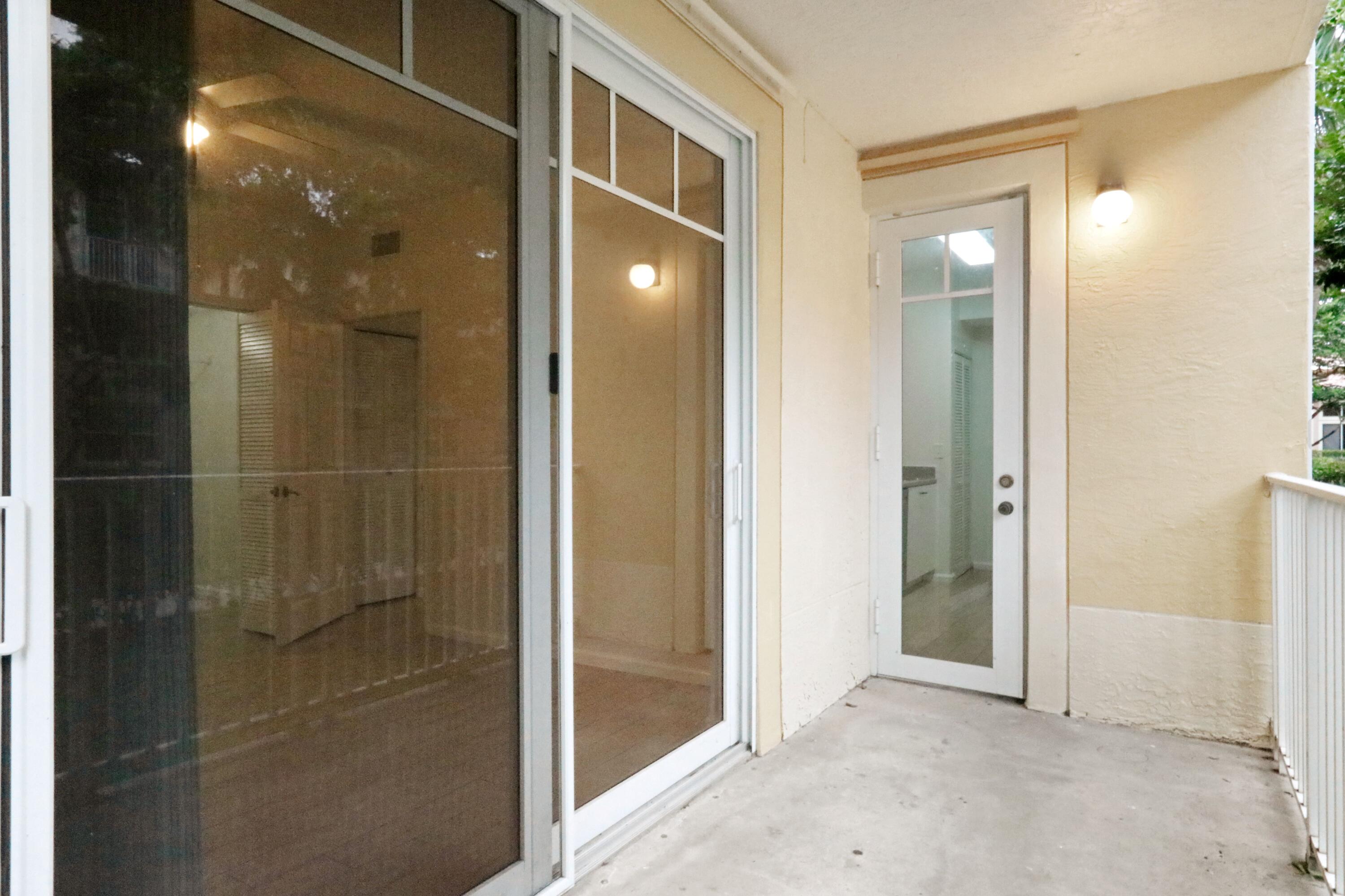 4784 Central Boulevard, Unit 10 Jupiter, FL 33458 - Photo 24 of 29 a bathroom with a glass shower door