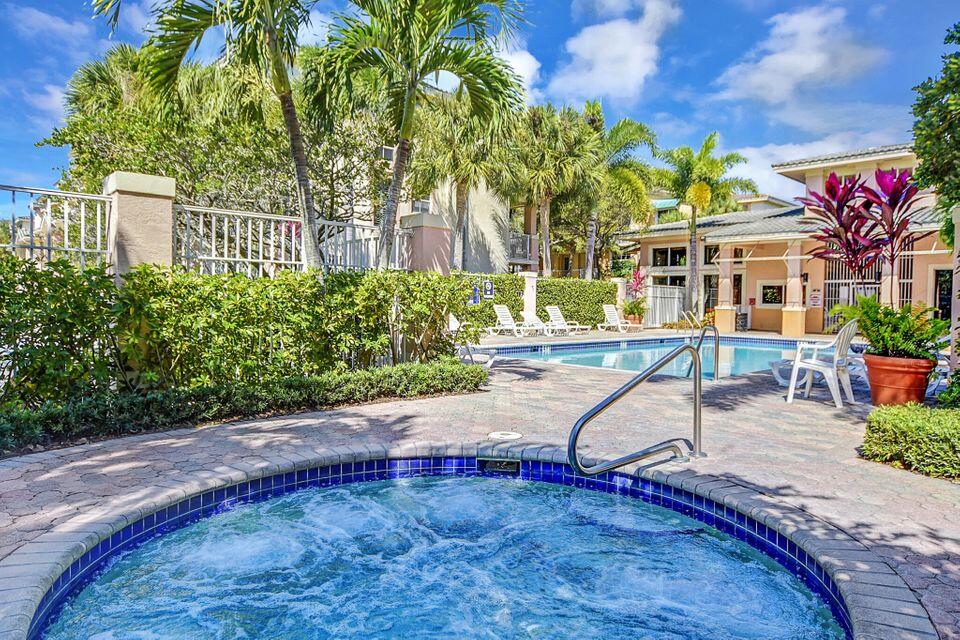 4784 Central Boulevard, Unit 10 Jupiter, FL 33458 - Photo 28 of 29 a view of a swimming pool with a patio