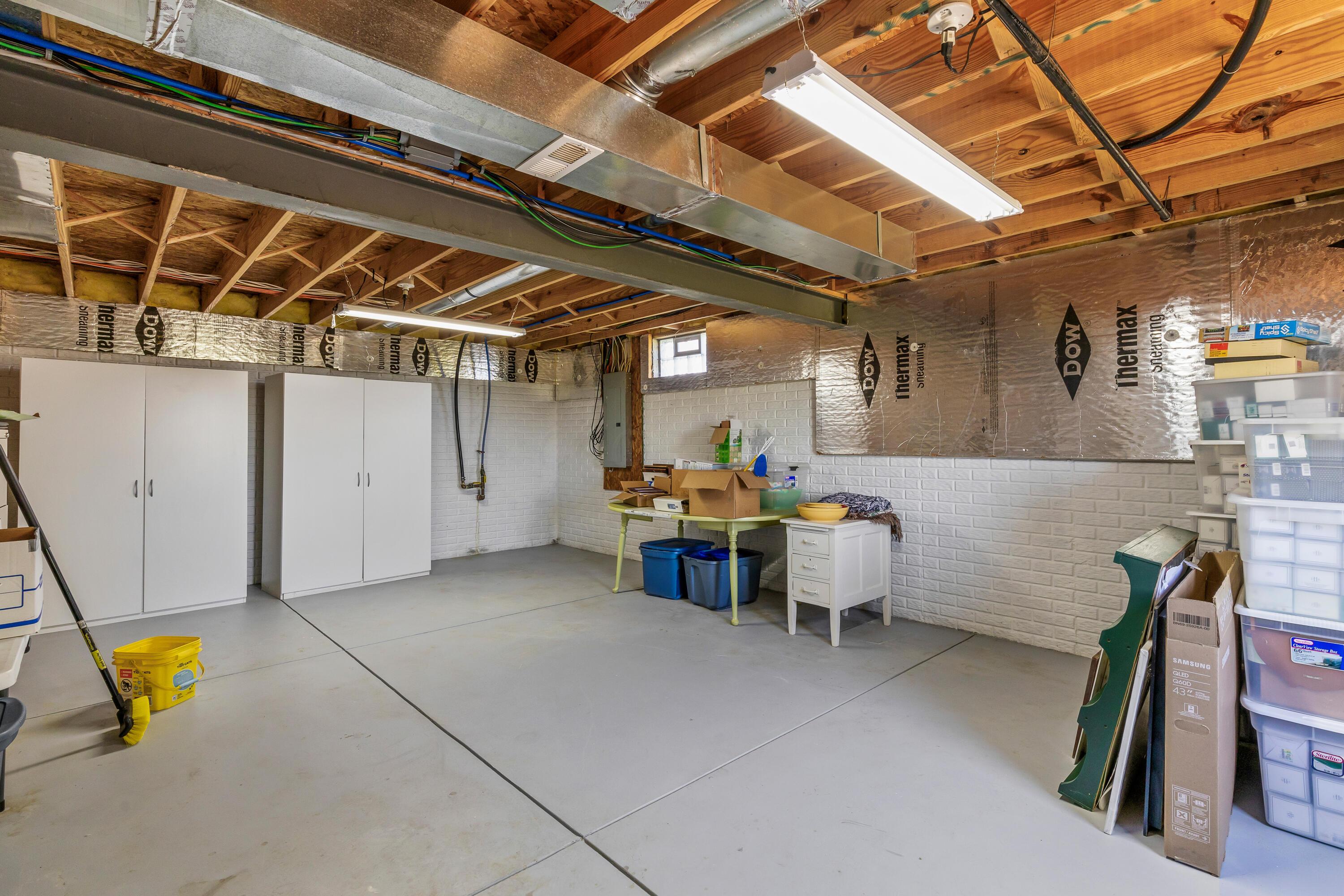 3582 Panhandle Road Delaware, OH 43015 - Photo 41 of 65 • New sump pump ~ 2025 • Walls partially insulated • Egress window • Glass block windows • Ceiling light