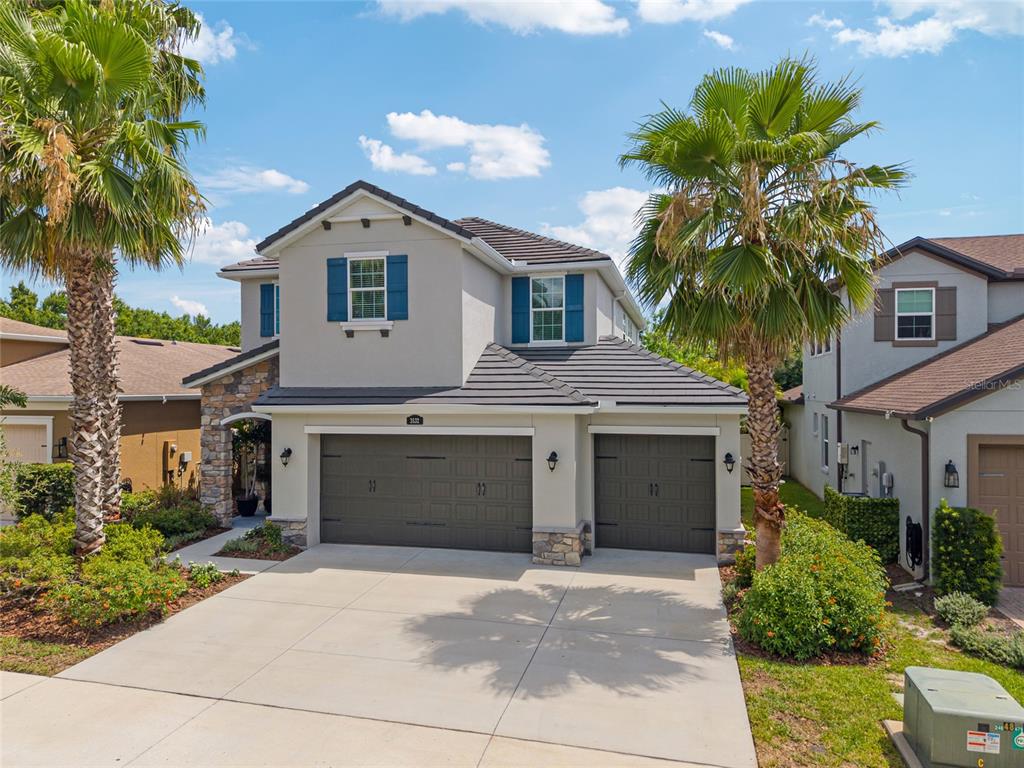 3532 Wicket Field Road Lutz, FL 33548 - Photo 1 of 1 a yellow house with a yard and a large tree