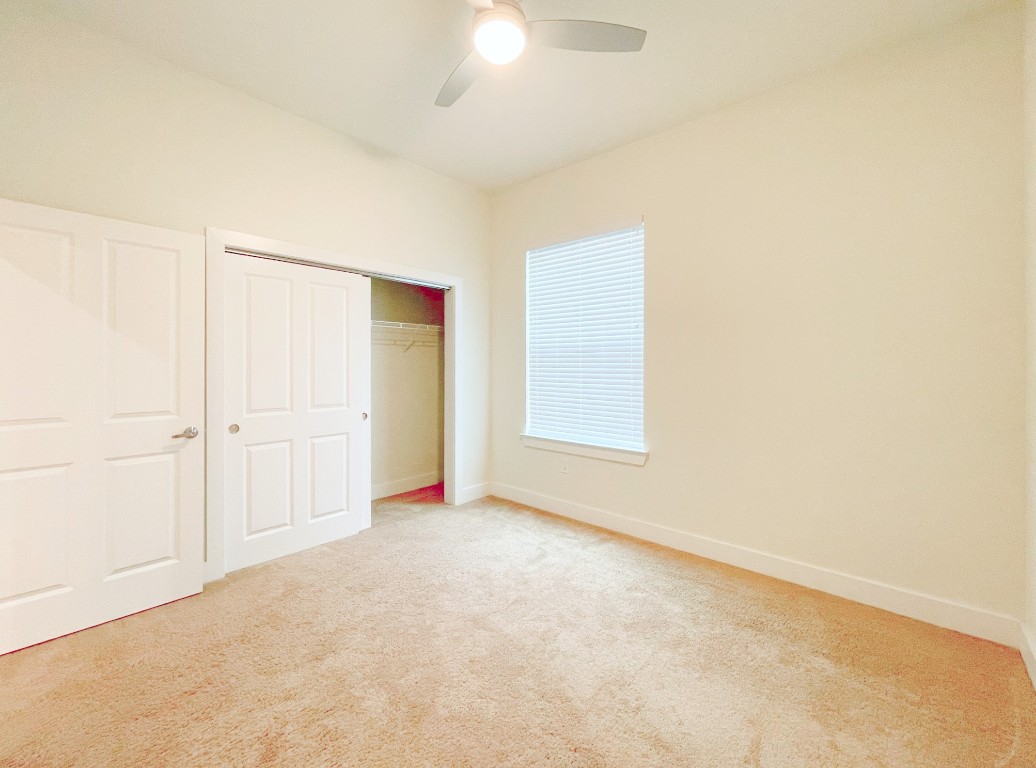 2400 Louis Henna Boulevard, Unit 103 Round Rock, TX 78664 - Photo 12 of 22 an empty room with a empty space and a window