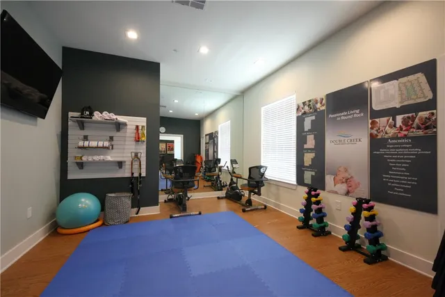 a room with furniture and a flat screen tv