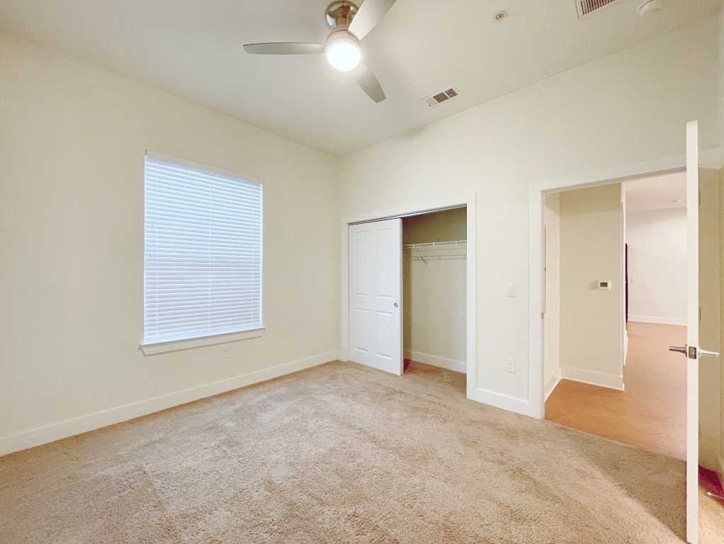 2400 Louis Henna Boulevard, Unit 103 Round Rock, TX 78664 - Photo 7 of 22 a view of an empty room with a window