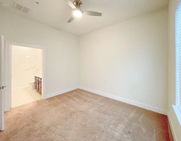 an empty room with a bathroom
