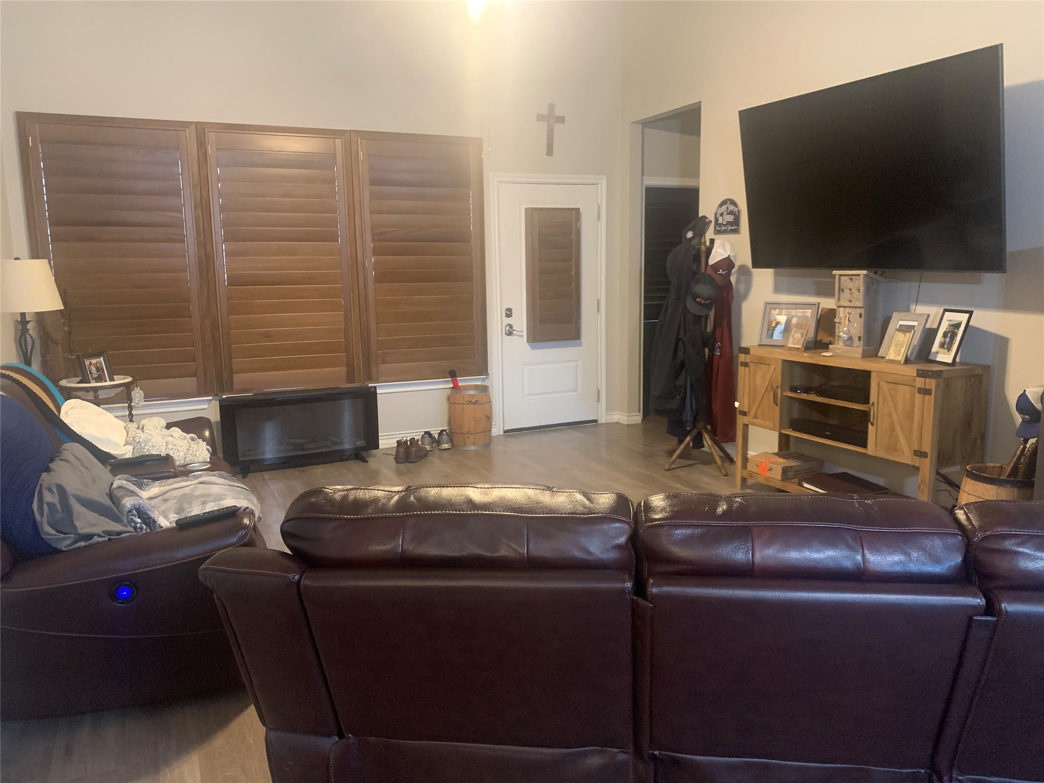 307 West Front Street Thorndale, TX 76577 - Photo 15 of 27 Living room with wood finished floors and a towering ceiling