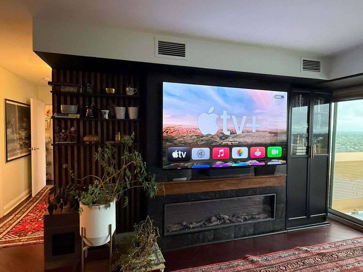 1720 Maple Avenue, Unit 2680 Evanston, IL 60201 - Photo 17 of 74 a living room with fireplace furniture and a flat screen tv