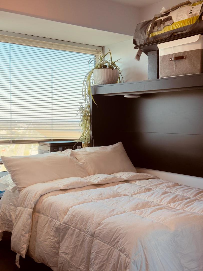 1720 Maple Avenue, Unit 2680 Evanston, IL 60201 - Photo 34 of 74 a bedroom with a bed and dresser