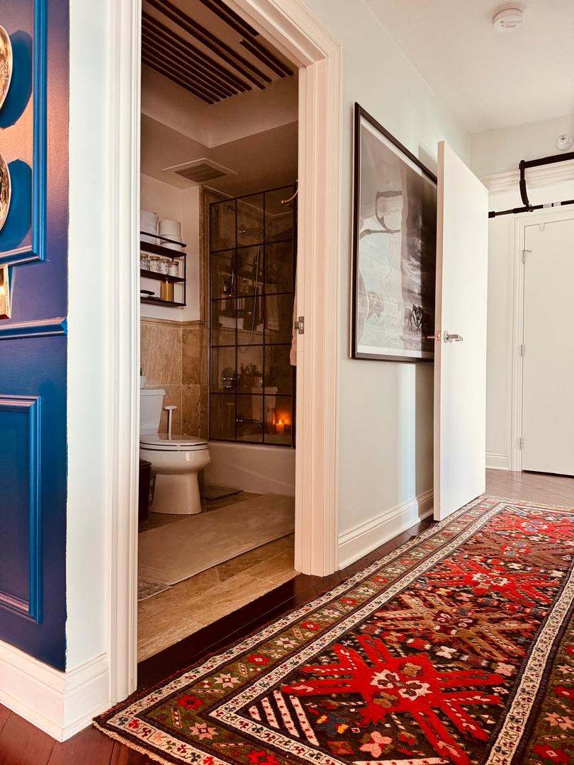 1720 Maple Avenue, Unit 2680 Evanston, IL 60201 - Photo 39 of 74 a view of a bedroom with wooden floor and bathroom