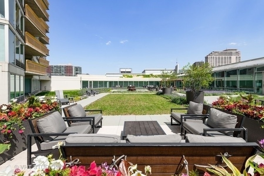 1720 Maple Avenue, Unit 2680 Evanston, IL 60201 - Photo 56 of 74 a view of a patio with couches table and chairs and potted plants