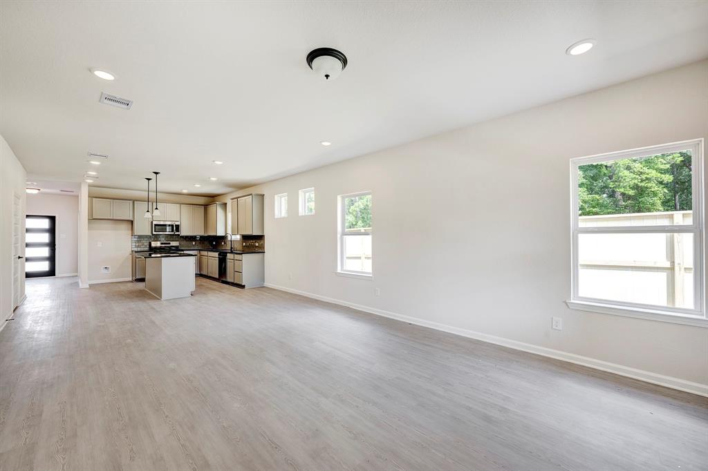 4336 Brayfield Road Fort Worth, TX 76036 - Photo 7 of 17 The Davenport II- Family Room into Dining Area and Kitchen