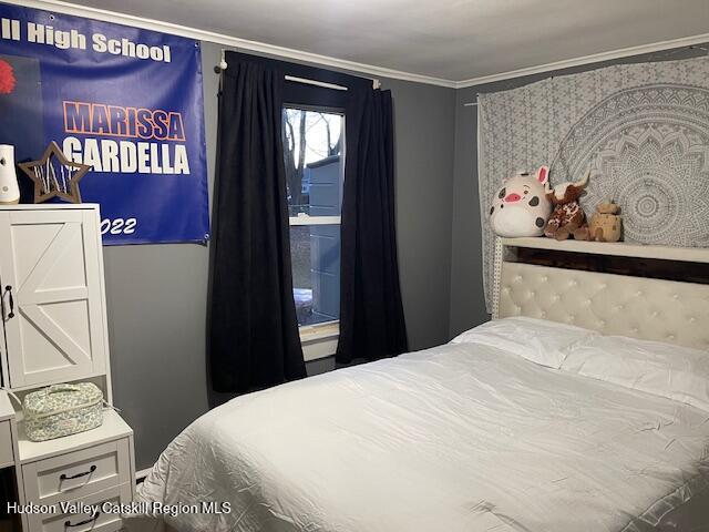 170 Broome Street Catskill, NY 12414 - Photo 11 of 18 a bedroom with a bed and a painting on the wall